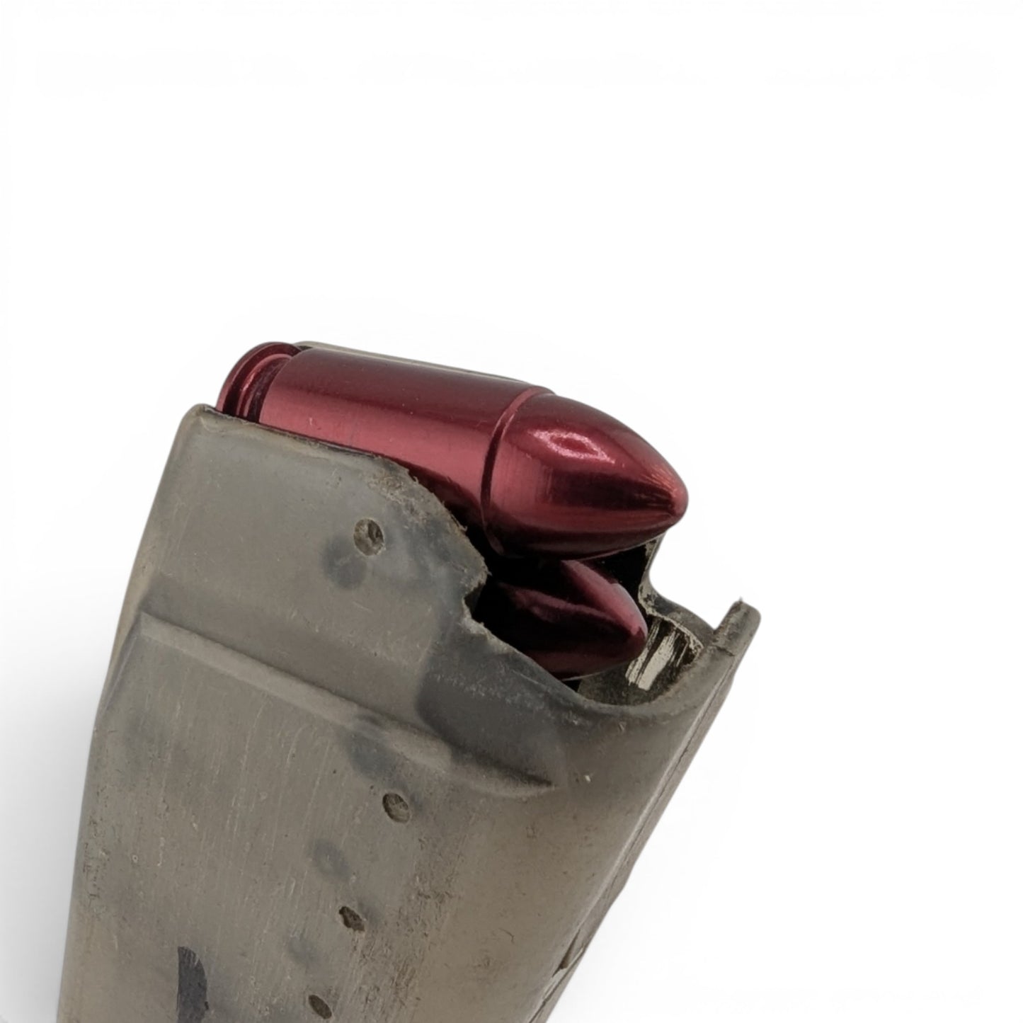 Adversary Force A-Zoom 9mm Luger red aluminum snap caps loaded in a grey polymer pistol magazine for dry fire training.